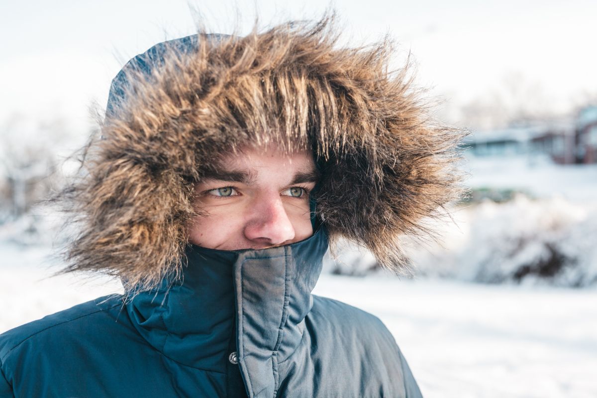 Woman in black parka jacket.