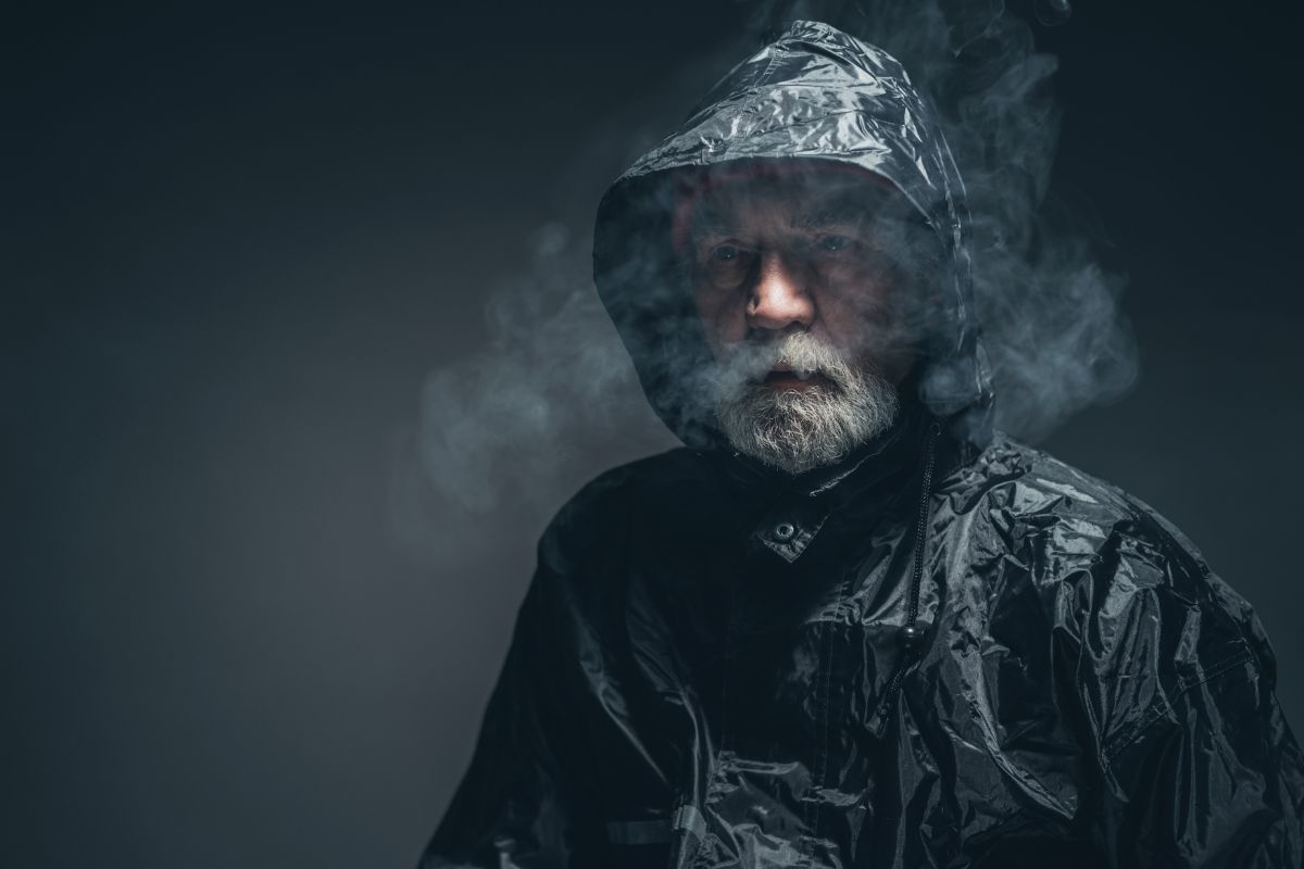 Pensive old guy in rain jacket.