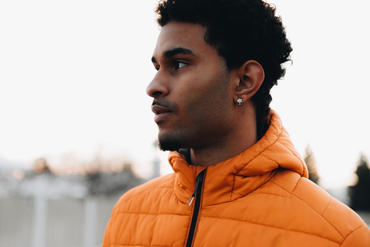 A man in orange puffer jacket.