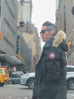 Man with Canada Goose black jacket in New York street.